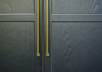 Modern Black Kitchen Cabinet with brass handles Mangan Woodcraft